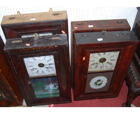 Four various early 20th century American mahogany drop trunk wall clocks