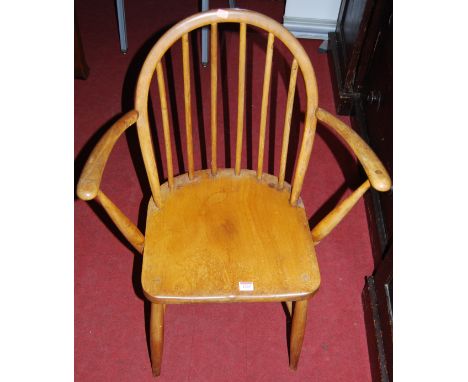 An Ercol elm stickback elbow chair, width 61cm