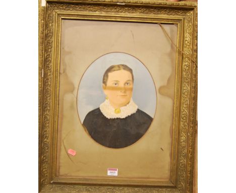 A Victorian overpainted portrait photograph