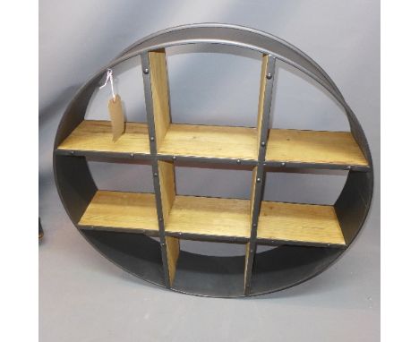 An Industrial round shelf unit having six shelves. 95x95cm 