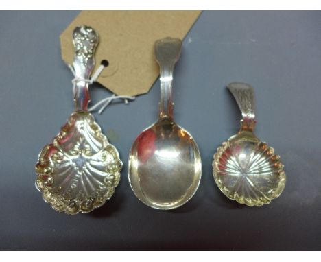 A George IV silver caddy spoon with fiddle thread and shell pattern, London 1824, together with a silver caddy spoon with sca