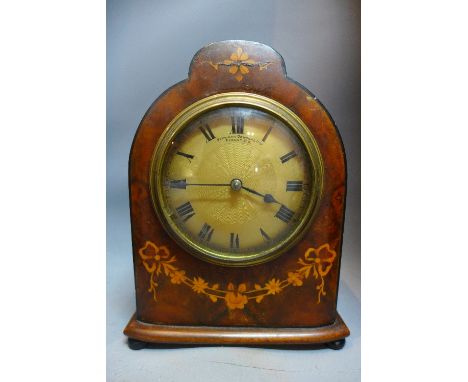An Edwardian mahogany mantle clock, marquetry inlay with flowers, the engine turned dial with Roman numeral, dial marked Stew