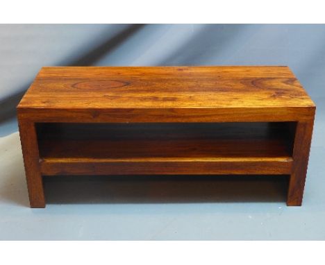 A teak two tier table, on bracket feet, H:45cm W:110cm D:45cm