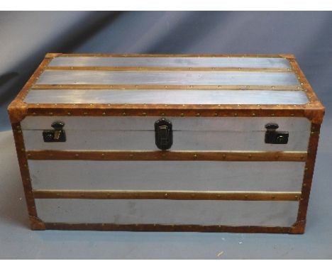 A contemporary leather and wooden board steamer trunk, H:51cm L:100cm D:51cm