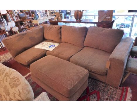 A Collins and Hayes corner sofa with brown fabric upholstery raised on block feet together with a matching ottoman