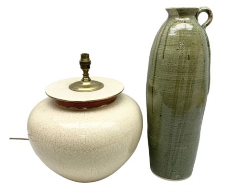 Large cream crackle glaze table lamp, together with a tall studio pottery vase in green with single loop handle, with impress