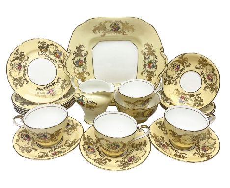 Aynsley tea service for six, decorated with floral sprays in ornate gilt detailing on cream ground, comprising six teacups an