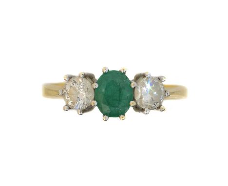 An 18ct gold emerald and diamond three stone ring,  An 18ct gold emerald and diamond three stone ring, the circular shape eme