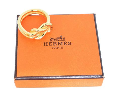 A Hermès scarf ring, A Hermès scarf ring, knotted design, signed Hermès. With maker's box.Overall condition goodLight scratch