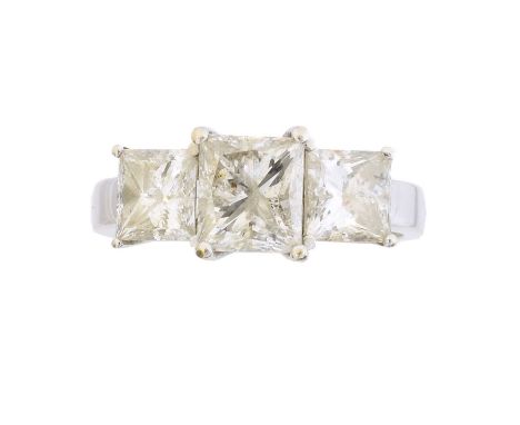 A diamond three stone ring, A diamond three stone ring, the square cut diamond line within shared claw settings, estimated to