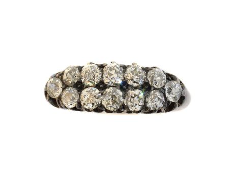 A late Victorian diamond dress ring,  A late Victorian diamond dress ring, designed as two old cut diamond rows with tapered 