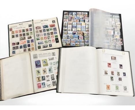 Four albums of vintage stamps, early 20th century and later.