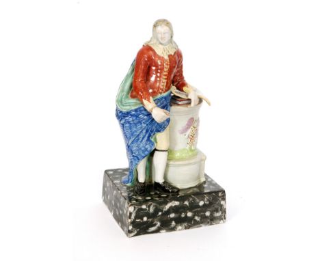 A large early 19th Century Staffordshire pearl ware Enoch Wood type portrait figure of John Milton, he stood on a black and w