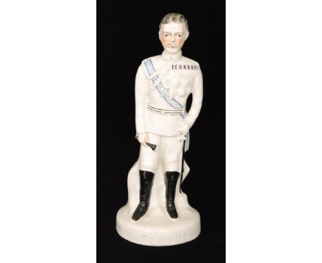 An early 20th Century Staffordshire portrait figure of General Lord Kitchener stood in his military uniform, titled to the fr