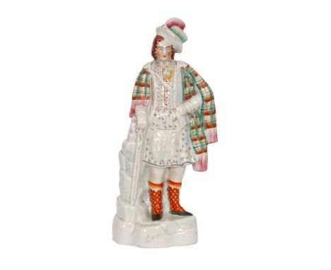 A 19th Century Staffordshire portrait figure of Robert Bruce, he stood in Scottish dress with a plaid shawl over his shoulder