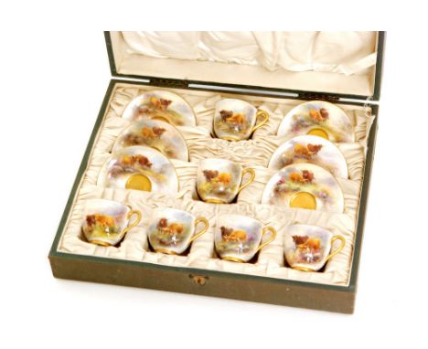 A cased set of six Royal Worcester coffee cups and saucers panel decorated by Harry Stinton with Highland cattle on a mossy b