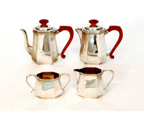 A George VI hallmarked silver four piece bachelors tea service, comprising of teapot, hot water pot, cream jug and sugar bowl