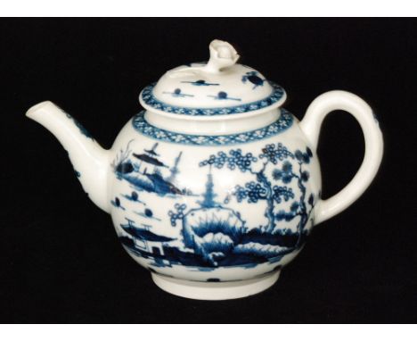 An 18th Century Worcester globular teapot decorated in the blue and white Cannonball pattern, the finial formed as a single f