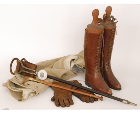 A pair of lady's brown leather riding boots with trees and spurs, together with a pair of leather motorists gauntlets, a shoo