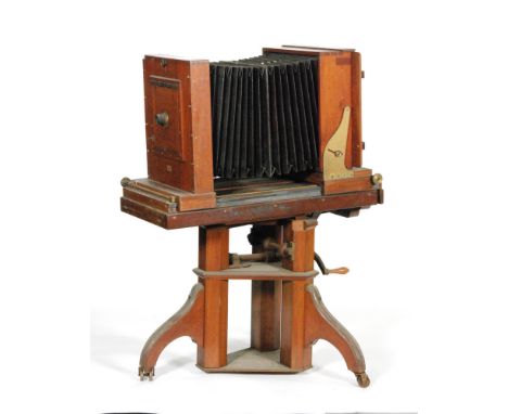 A Victorian brass mounted portrait camera with adjustable tripod stand, width 93cm