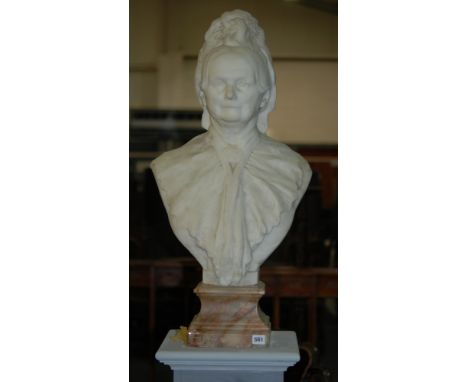 A late 19th Century marble bust of an elderly lady wearing a portrait necklace to her neck on alabaster shaped base, signed C