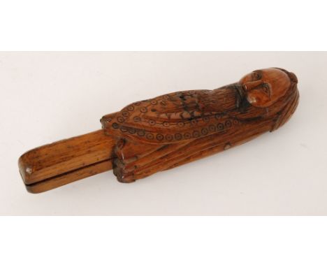 A 19th Century carved oak nutcracker of a bearded figure stamped 'Cop of original now 1874 rotten with age pray preserve this