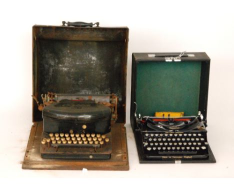 A 20th Century Empire No 2 typewriter on wooden base enclosed by a metal case together with a later Imperial portable typewri