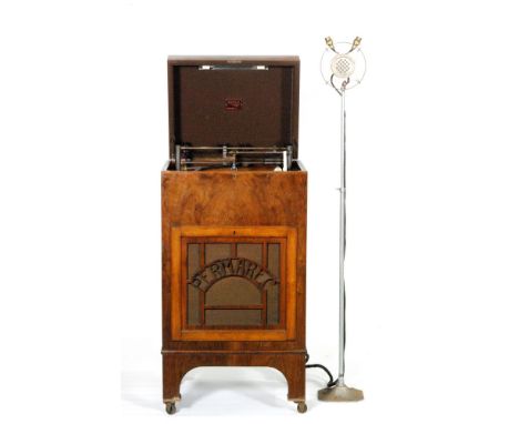 A 1930s Permarec floor standing record recorder in figured walnut case, the hinged lid opening to reveal a turn table and a D