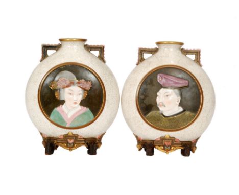 A pair of 19th Century Worcester Aesthetic moon flask vases, the first decorated in relief with a roundel portrait of a Japan