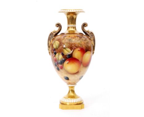 A Royal Worcester Fallen Fruits twin handled pedestal vase decorated in the round with hand painted peaches and grapes to one