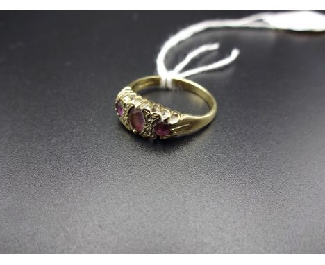 9K GOLD RING WITH PURPLE STONES 2.4g