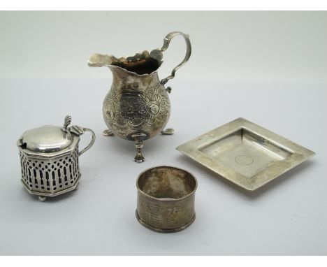A Hallmarked Silver Cream Jug, the bulbous body raised on three hoof feet, with decorative embossed floral band, initialled t
