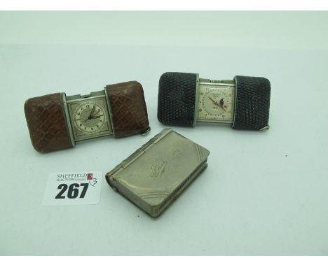 Movado: Two Vintage Miniature Travel Clocks, with slide closing cases, together with a novelty book style vesta and stamp cas