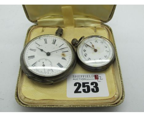 An Openface Pocketwatch, the unsigned white dial (damaged) with Roman numerals and seconds subsidiary dial, in engine turned 