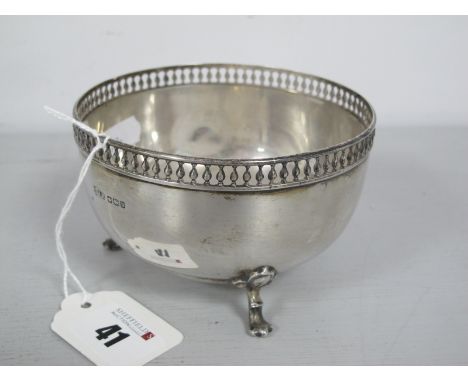 A Hallmarked Silver Circular Bowl, with pierced rim, raised on three hoof feet, J. R Sheffield, 1913 (150 grams).