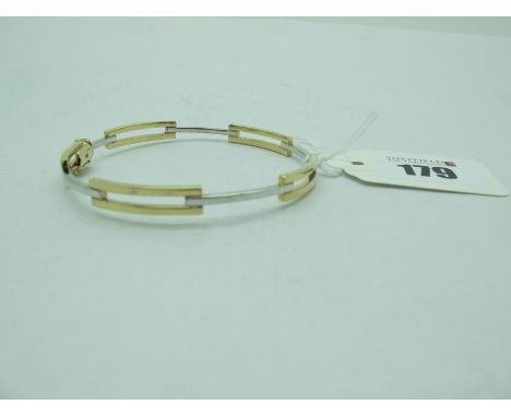A Modern Two Tone Openwork Bangle, stamped "375" (6.5 grams). Lot 179 - The bangle has light surface scratches typical with w