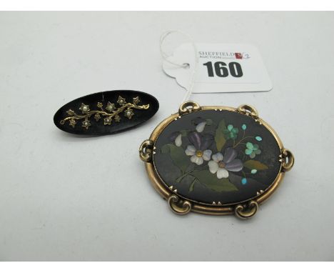 A Victorian Style Brooch, the oval panel of inset mosaic style, depicting a floral spray, collet set in decorative mount, tog