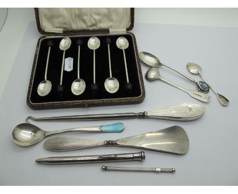 A Cased Set of Six Hallmarked Silver Coffee Spoons, a hallmarked silver handled shoe horn of engine turned design, a similar 