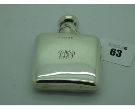 A Hallmarked Silver Hip Flask, London 1925, of plain design, initialled (dented) (78 grams). 