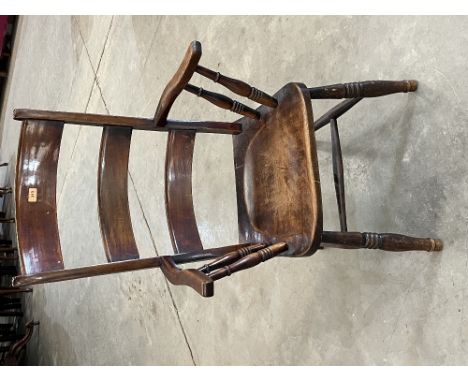 A Victorian ladder back kitchen armchair on splayed legs 