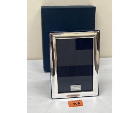 An Elizabeth II silver photograph frame. 7' high. As new, boxed.