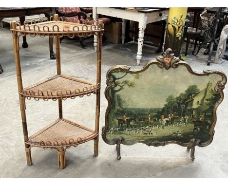 A bamboo three tier corner etagere with a gilt firescreen