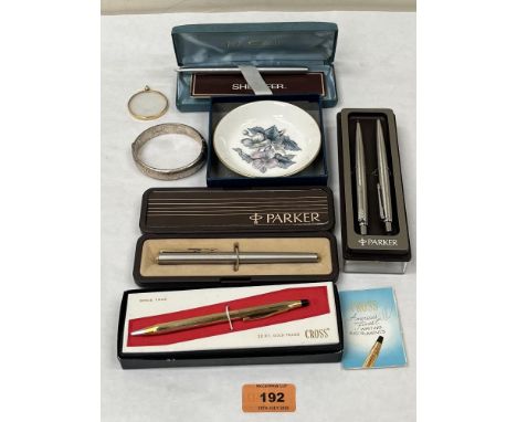 A silver bangle; a Cross pen, other pens etc.