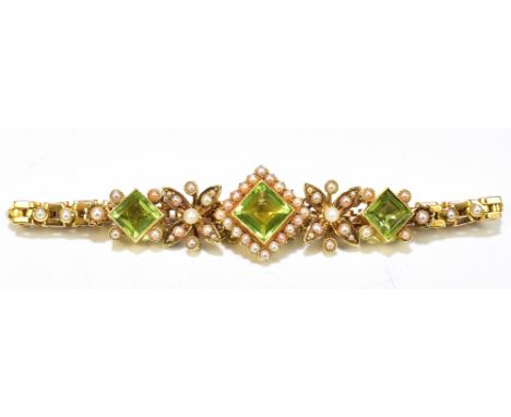 An&nbsp;Edwardian 15ct yellow gold peridot and seed pearl bracelet, the bracelet set with three square cut peridots, the larg