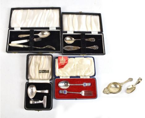 A group of hallmarked silver flatware to include Edward VII Coronation spoon and fork set with enamel decoration, food pusher