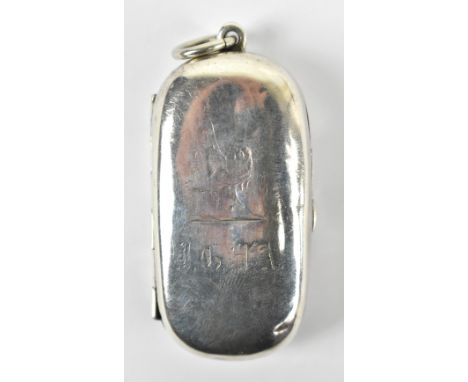 An Edward VII hallmarked silver sovereign and half sovereign case of oval form with engraved initials and lion rampant to the