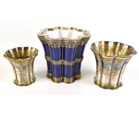 AAGE ALBING; two Danish sterling silver 'Queen Margethe' cups of graduated size with gilt washed interiors modelled after the