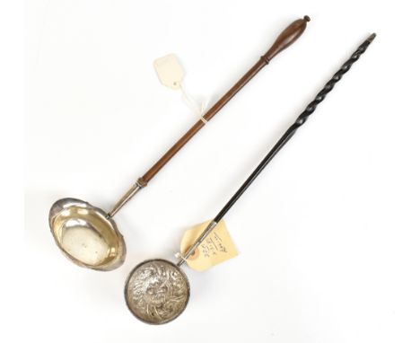 A Georgian silver toddy ladle with repousse foliate decoration to bowl and baleen handle, unmarked, length 36cm, and a furthe