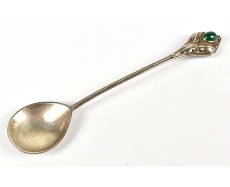 HENRY GEORGE MURPHY; a George V hallmarked silver Arts &amp; Crafts conserve spoon, the lozenge shaped terminal featuring thr