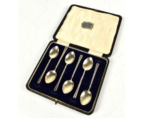 TURNER &amp; SIMPSON LTD; a cased set of Elizabeth II hallmarked silver teaspoons with enamelled foliate detail to bowl rever